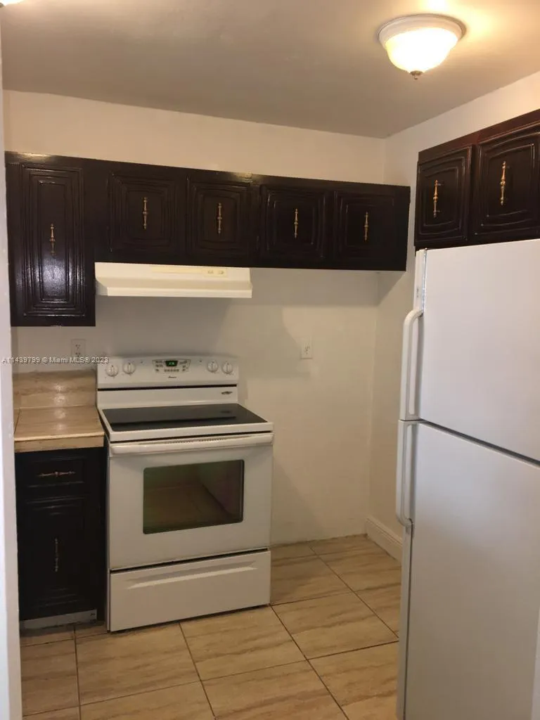 498 NW 165th St Rd # D205, Miami FL 33169