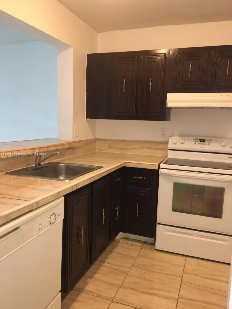 498 NW 165th St Rd # D205, Miami FL 33169
