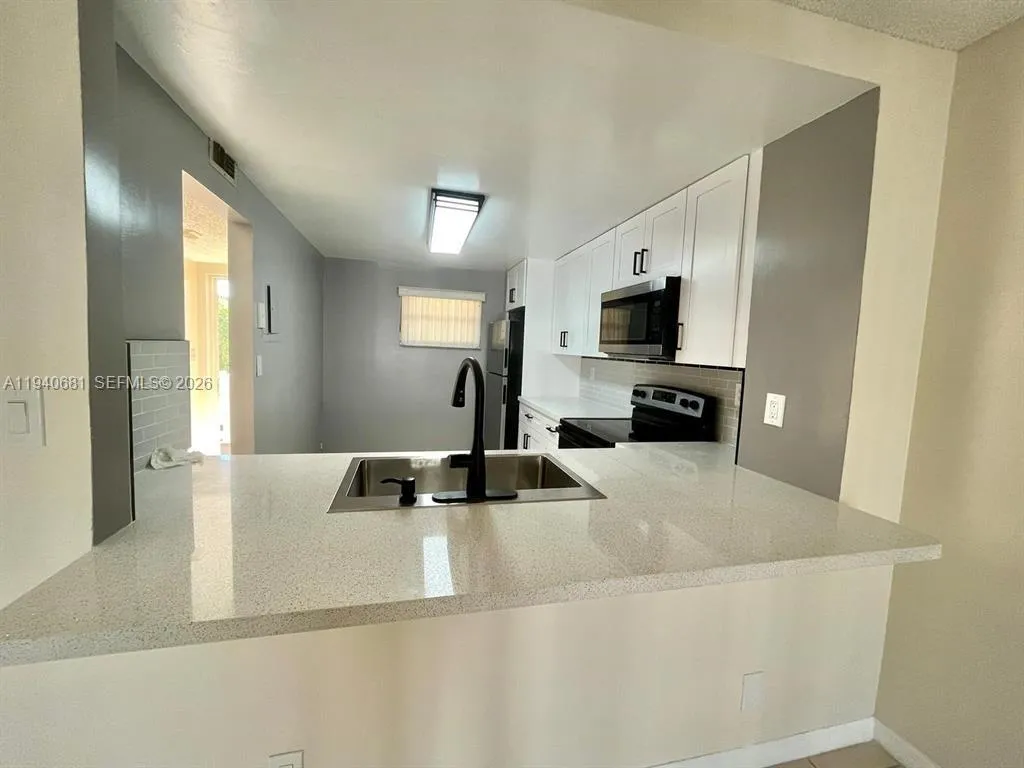 1100 NW 87th Ave # 403, Coral Springs FL 33071