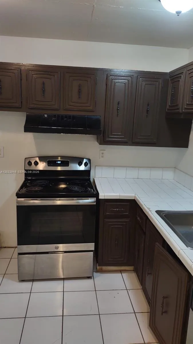 496 NW 165th St Rd # D109, Miami FL 33169