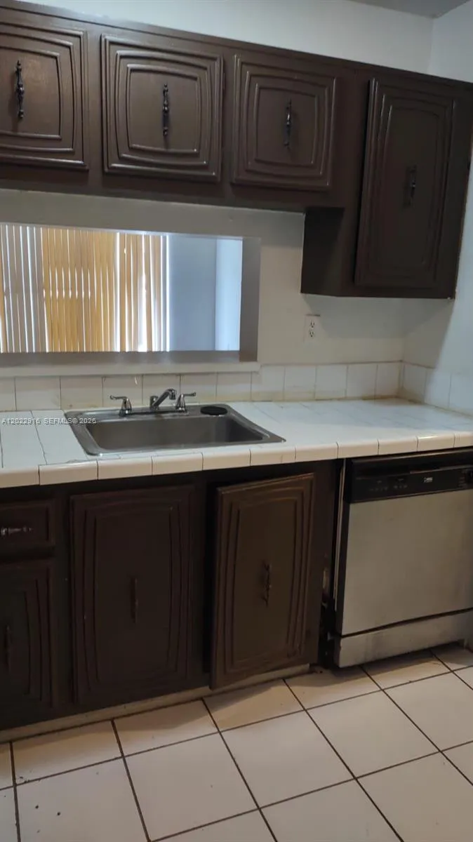 496 NW 165th St Rd # D109, Miami FL 33169