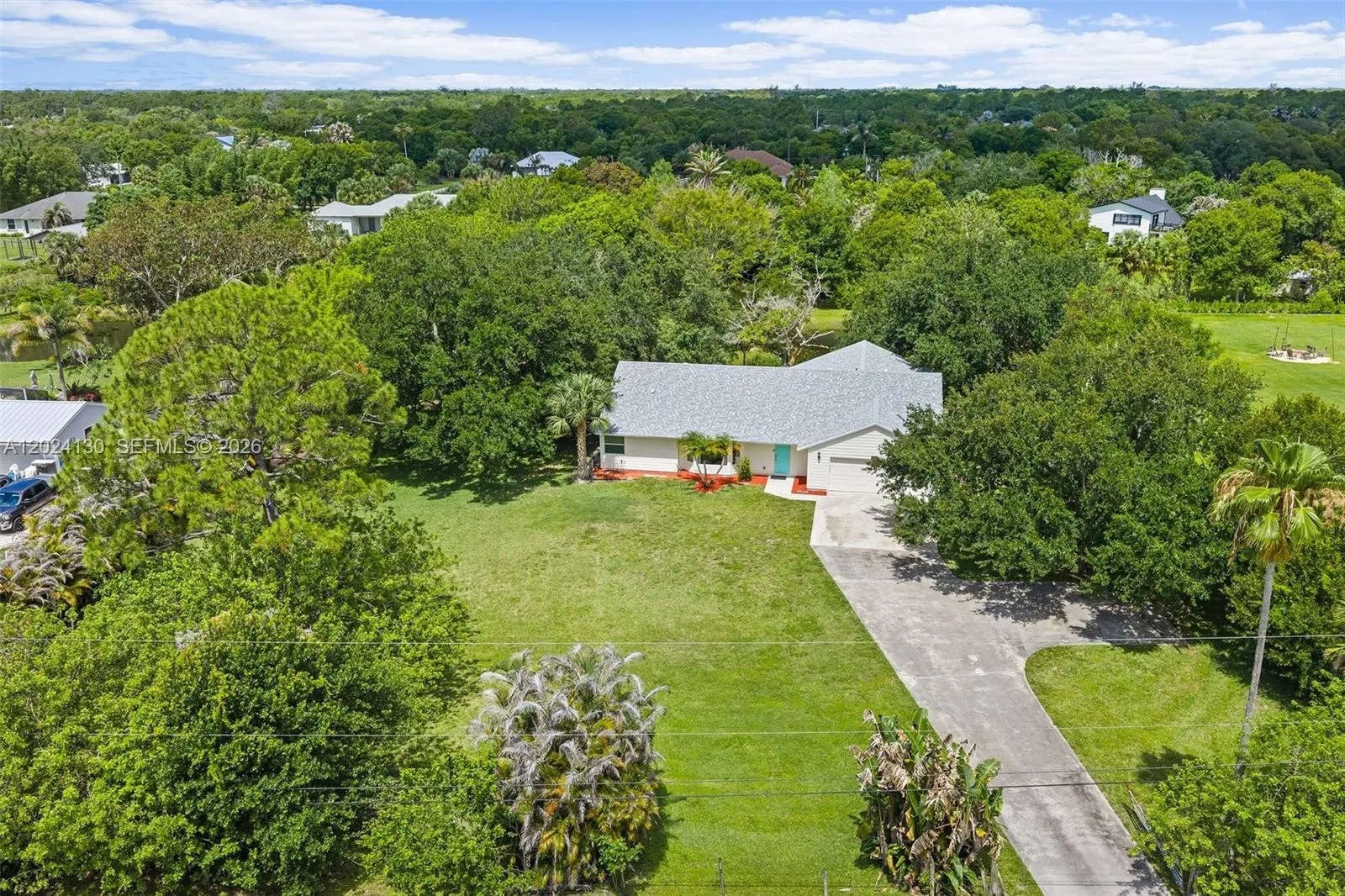 4 bedroom 2 bath for sale at 15305 N 96th St N, Palm Beach FL 33478