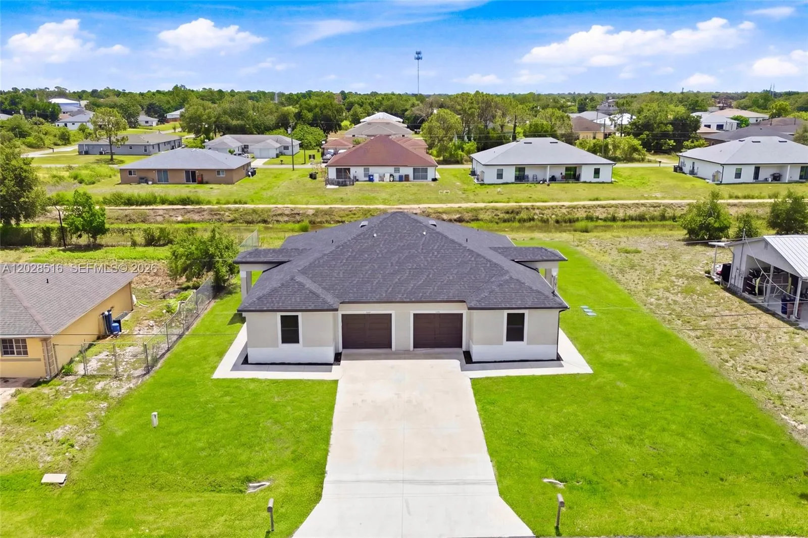 225/227 Hightower AVE S, Lehigh Acres FL 33973